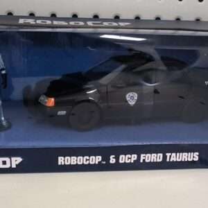 Robocop Hollywood Rides Diecast Model 1/24 1986 Ford Taurus Con Robocop Figura Jada Toys Scatola Rovinata